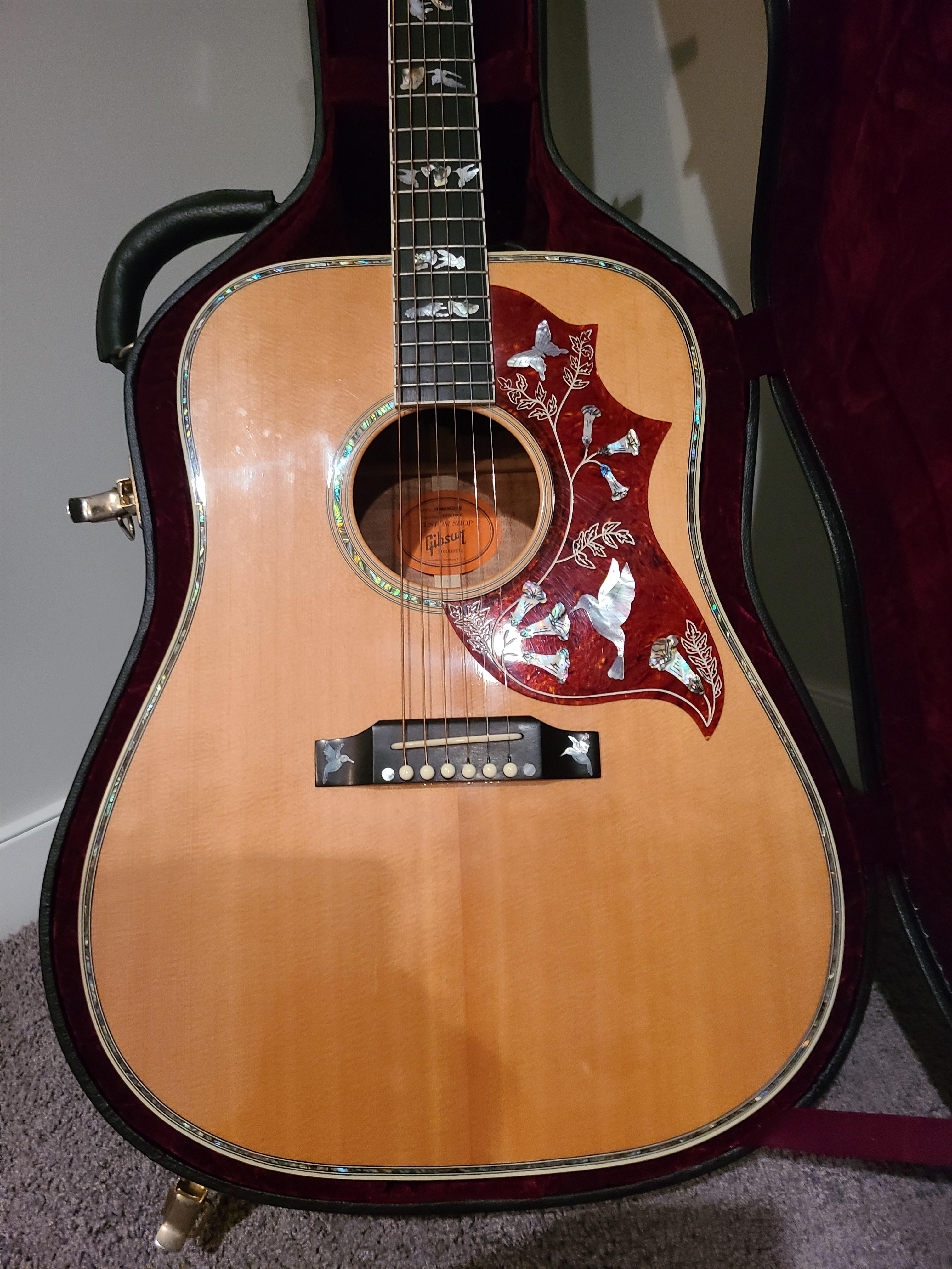 Photo of Gibson hummingbird Koa custom acoustic electric guitar. Like new condition 