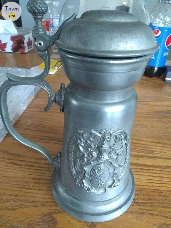 Photo of 2 vintage pewter mugs