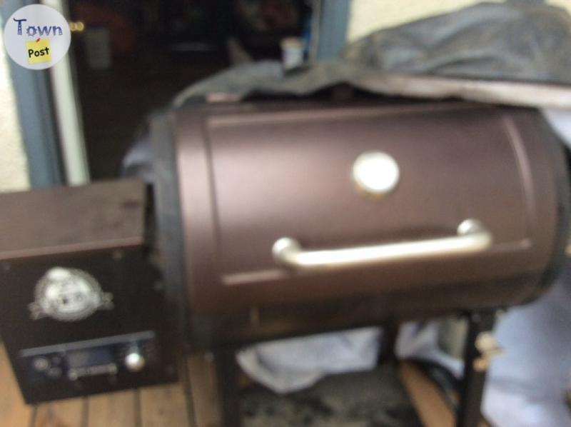 Photo of Pit boss smoker for sale cw 250lbs of assorted pellets 