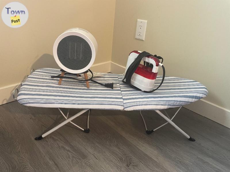 Photo of Space heater, ironing board and iron steamer