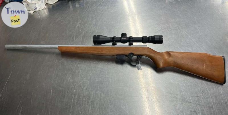 Photo of MOSSBERG INT'L 817 .17HMR WOOD STOCK pluncker